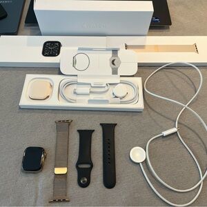 Apple Smartwatch with Gold and Black Accessories
